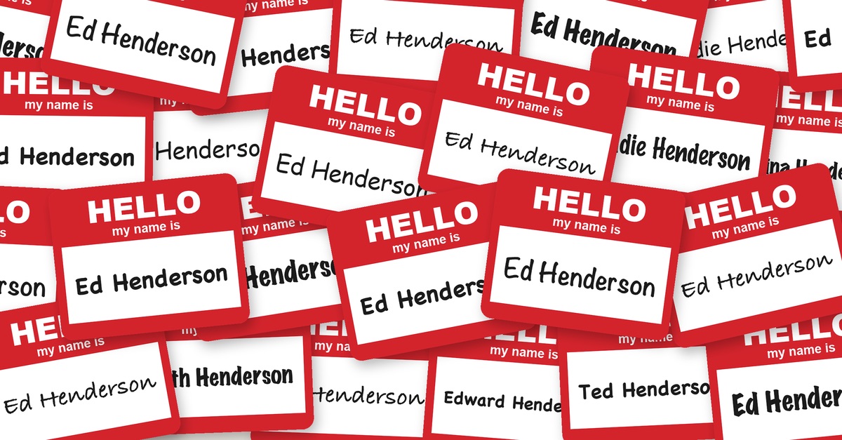 A pile of red "Hello, my name is" badges, nearly all saying Ed Henderson in different handwriting, with the odd Edward, Edith, Edie and Eddie.